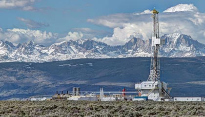 Oil Drilling Rig surrounded by mountains